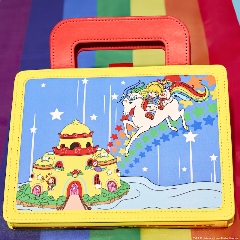 Loungefly Rainbow Brite Lunchbox Stationery Journal, featuring Color Castle and Rainbow Brite, sitting on a rainbow background